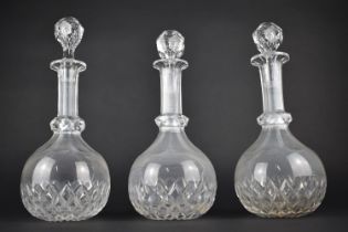 Three Cut Glass Decanters of Globe and Shaft Form with Knopped Stems and Diamond Cut Detail to