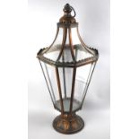 A Brushed Metal Lantern with Tapering Glass Panels on Circular Acanthus Decorated Foot, 69cms High