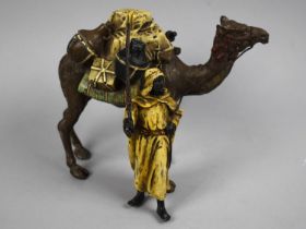 A Reproduction Cold Painted Bronze Figure Group Depicting Camel and Trader, 14cms High