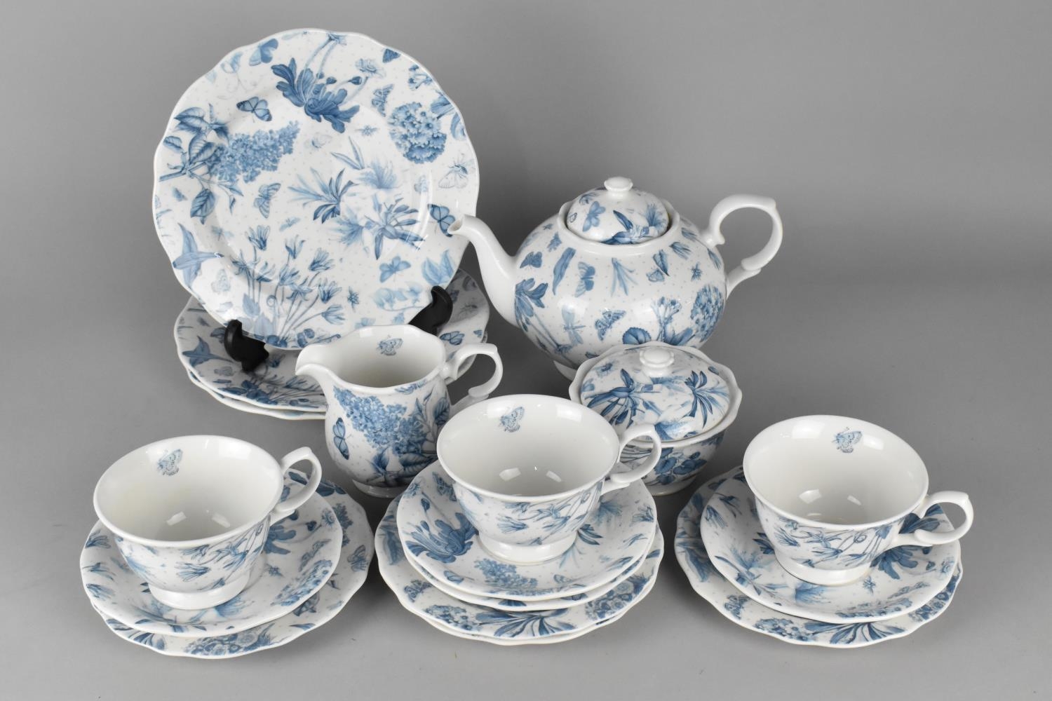 A Portmeirion Botanic Blue Part Tea Set to comprise Tea Pot, Three Cups, Saucers, Side Plates, Small