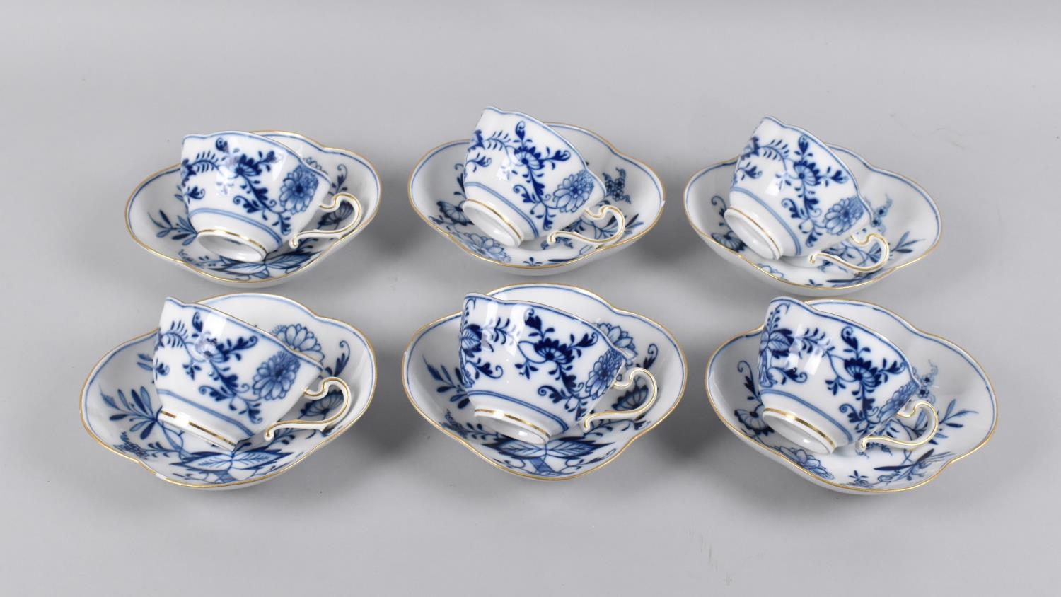 A Set of Six Blue and White German Porcelain Cups and Saucers, Quatrefoil Form decorated in the