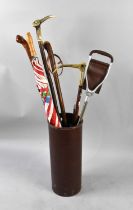 WITHDRAWN: A Leather Mounted Stick Stand Containing Various Sticks, Umbrella Etc