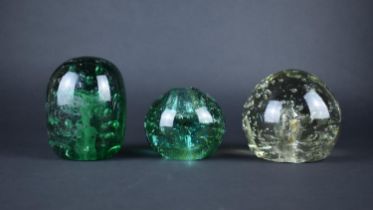Three Victorian Glass Dump Weights to comprise Two Green Examples, 11cms and 7cms High and One Clear