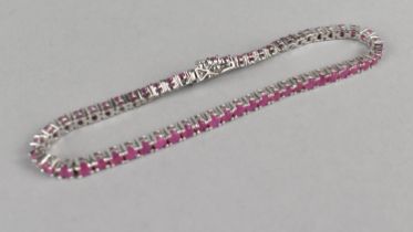 A Silver and Pink Stone Tennis Bracelet Comprising Round Cut Stones in Four Claw Mounts