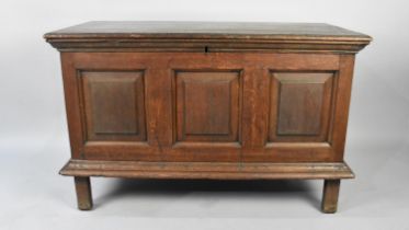 An 18th/19th Century Oak Coffer, the Hinged Lid over Three Inverted Panels and Moulded Apron on