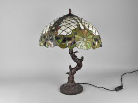 A Tiffany Style Table Lamp with Bronzed Branch Supports (Shade with Some Damage) 57cms High