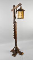 A 1960s Oak Uplighter in the Form of a Lantern on Hanging Stand, 159cms High