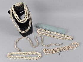 A Collection of Various Faux Pearl Necklaces