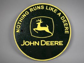 A Reproduction Painted Cast Metal Plaque, John Deere, 24cms Diameter