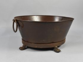 A Cast Metal Foot Bath with Twin Ring Handles on Four Claw Feet, 74cms Wide