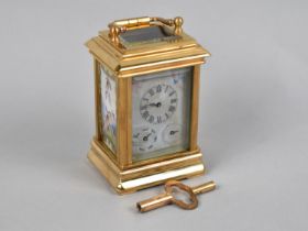 A Miniature Reproduction Sevres Style Carriage Clock with Painted Porcelain Panels Depicting