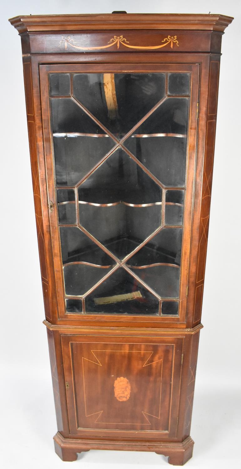 An Edwardian Mahogany Sheraton Revival Free Standing Corner Cupboard With Moulded Corners with
