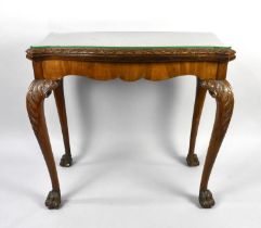 A Mahogany Card Table on Cabriole Supports Culminating From Acanthus Leaf Tapering to Claw Feet,