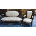 A 19th Century Victorian Walnut Upholstered Sofa with Carved Frame together with a Similar Victorian