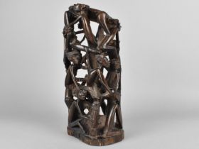 An African Hardwood Carving/Stand, In a Round with Figures, 27cms High