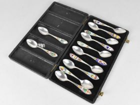 A Box Containing Twelve Silver and Enamel Teaspoons having Canadian Town and City Crests,