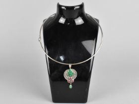 A Silver Hooped Necklace with Drop Pendant having Eastern Green and Purple Cabochon Stones