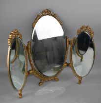 A Gilt Framed Triple Dressing Mirror with Ornate Pierced Finials