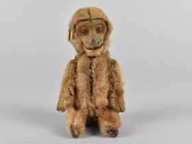An Early 20th Century Schuco Monkey Scent Bottle with Gold Mohair, Tin Plate Base and Felt Ears, the