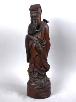A Reproduction Chinese Carved Wooden Study of Immortal, 38cms High