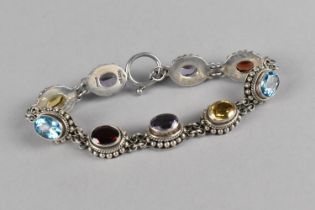 A 925 Silver Sectional Bracelet with Multi Coloured Oval Cut Stones to include Citrine, Topaz,