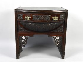 A Carved Stand with Bow Front Drawer, Scrolled Brackets and Domed Front, 58cms Wide