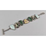 An Eastern Style Silver, Dalmatian Jasper, Larimar and Malachite Style Stone Sectional Bracelet with