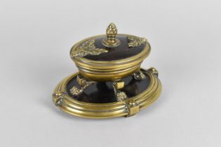 A 19th Century Bronze and Rosewood Desk Stand of Oval Form Raised on Four Claw Feet with Pineapple