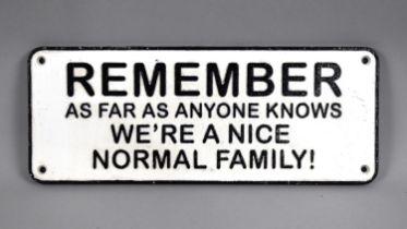 A Painted Cast Metal Plaque 'Remember as Far As Anyone Knows We Are A Nice, Normal Family' 34cms