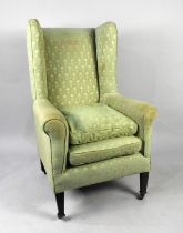 A George III Style Wingback Fireside Armchair on Castor Supports