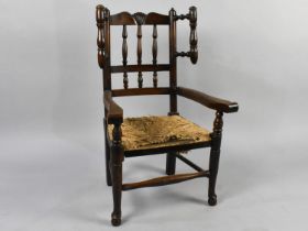 A 19th Century Childs Ash and Elm Rush Seated Wing Back Kitchen Chair with Spindle Back and Front
