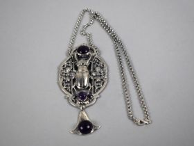 A Sterling Silver Reproduction Egyptian Revival Large Pendant with Purple Cabochon on Silver