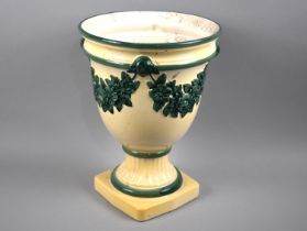 A Hand Painted Jardiniere of Urn Form decorated in Shallow Relief with Floral Swag on Square