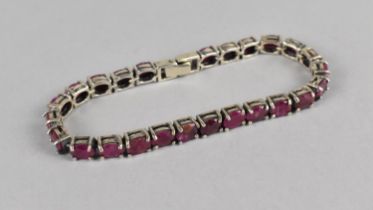 A Silver and Purple Stone Tennis Bracelet