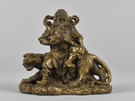 A Bronze Study of Chinese Warlord Seated on Snarling Tiger, 15cms High