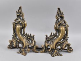 A Pair of Late 19th/Early 20th Century Brass Rococo Style Fire Dogs of Scrolled and Foliate