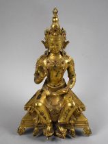 A Reproduction Gilt Bronze Study of Buddha Seated On Throne, 24cms High