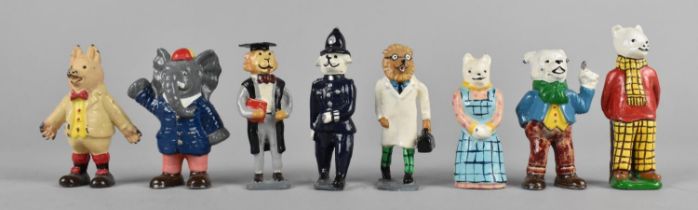 A Collection of Eight Various Cold Painted Metal Rupert Figures