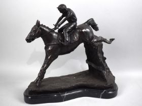 A Cast Bronze Study of Jockey and Horse Clearing Fence on Marble Base, 32cms High
