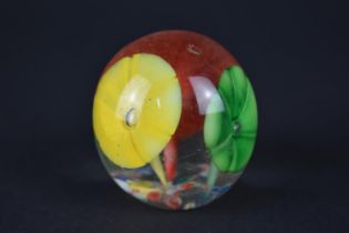 A Small Glass Paperweight Decorated with Flowers, 4.5cms High