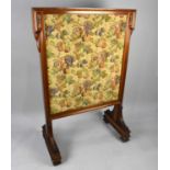 A Victorian Walnut Framed Country House Firescreen, Having a Fruit and Foliate Needlework Panel,