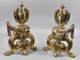 A Pair of Early 20th Century Polished Brass Fire Dogs in the Rococo Style, Pineapple Finial and