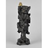 A Chinese Carved Wooden Lamp Base in the Form of a Chinese Elder, 58cms High