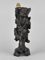 A Chinese Carved Wooden Lamp Base in the Form of a Chinese Elder, 58cms High