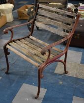 A Vintage Heavy Cast Iron and Wooden Slatted Garden Armchair with Scrolled Supports