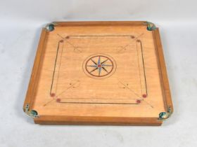 An Indian Table Top "Carrom" Board Game in Which Players Flick Discs Attempting to Knock Them to The