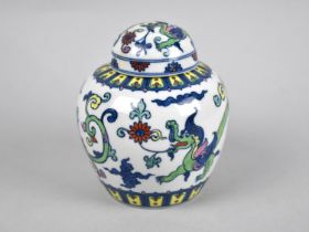 An Oriental Porcelain Ginger Jar and Cover Decorated with Dragons and Scrolls, 7cms High
