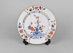 A Chinese Qing Dynasty Porcelain Plate, 18th Century, Decorated in the Imari Palette with