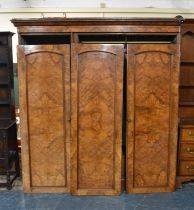 A Victorian Burr Walnut Triple Wardrobe with Panelled Doors to End Fitted Section with Three