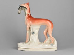 A 19th Century Staffordshire Study of a Greyhound with Hare in Mouth, 29cms High, Condition Issues